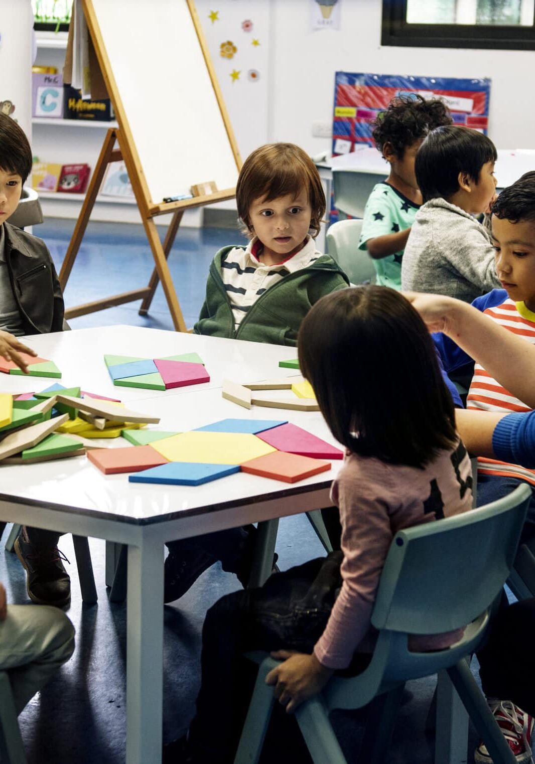 Happy baby playing with toy blocks.
